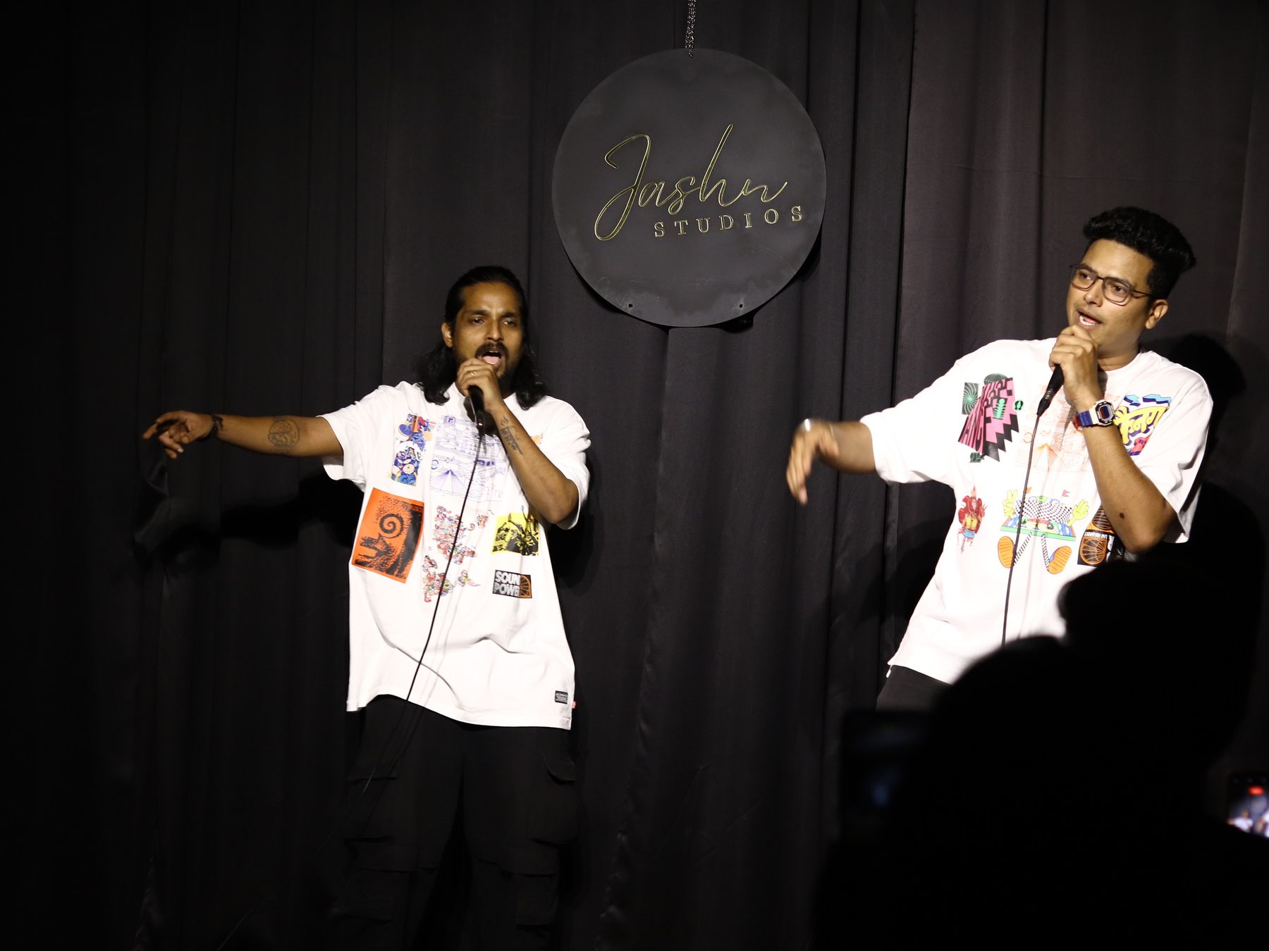Two ODD GEN artists trading verses on stage